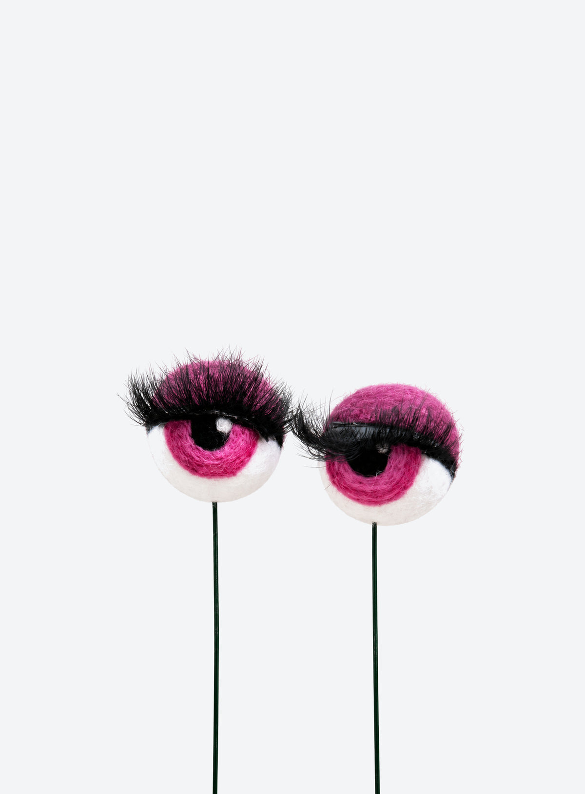 Felt eyeball plant stakes with colorful eyeshadow, eyelashes, and floral wire stems