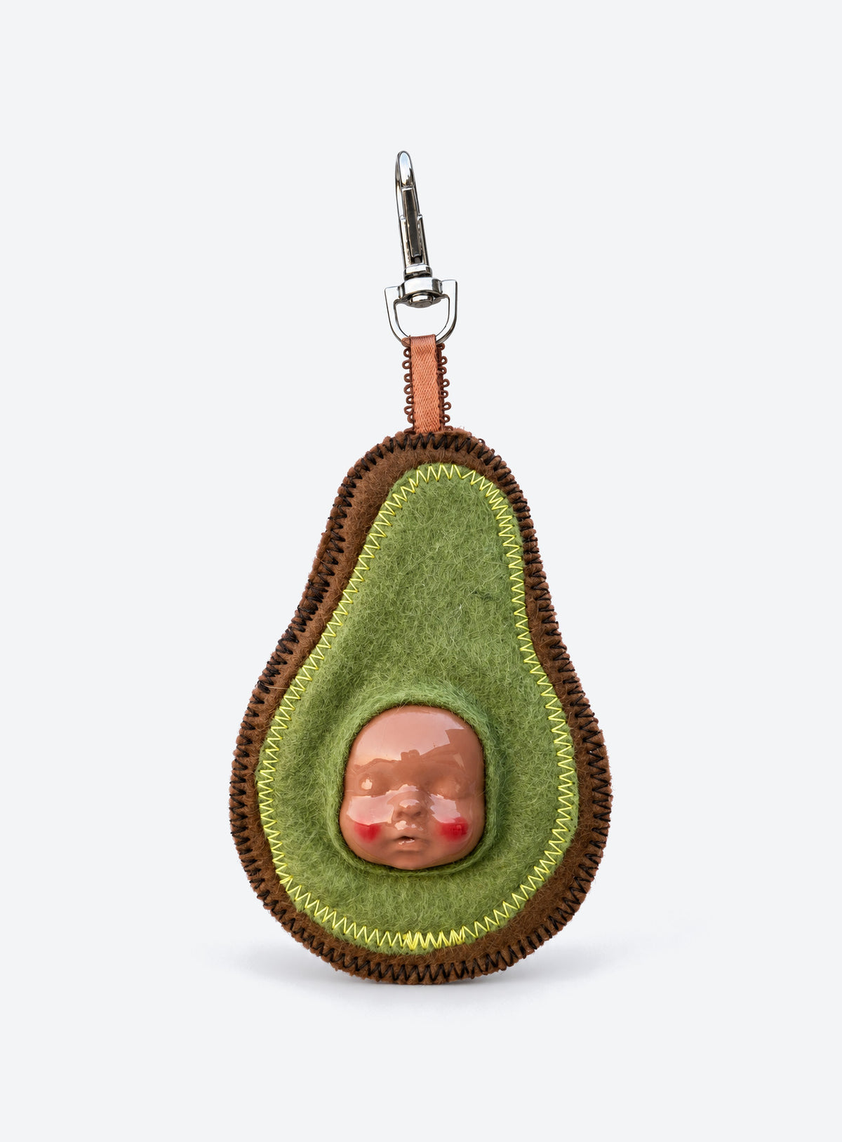 Handmade orange-shaped felt bag charm with a sculpted baby face, green leaves and a metal clasp