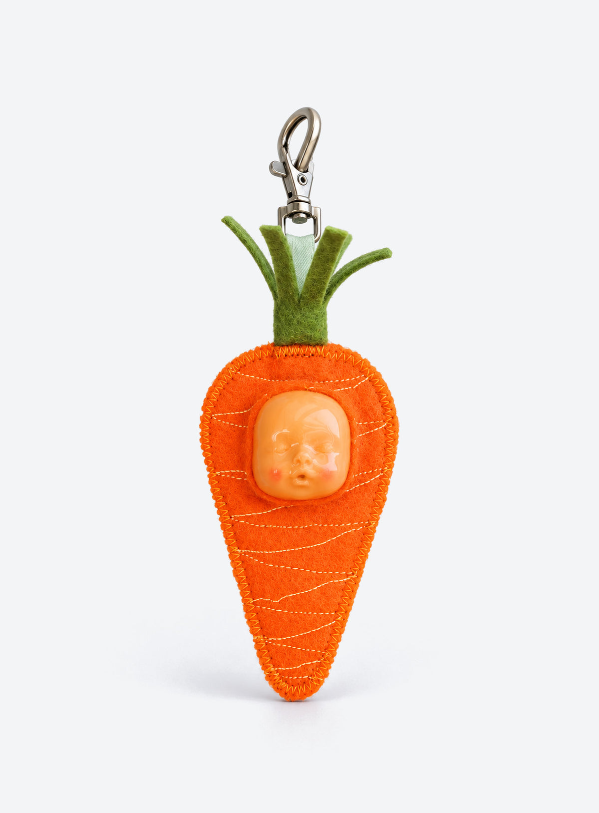 Handmade orange-shaped felt bag charm with a sculpted baby face, green leaves and a metal clasp