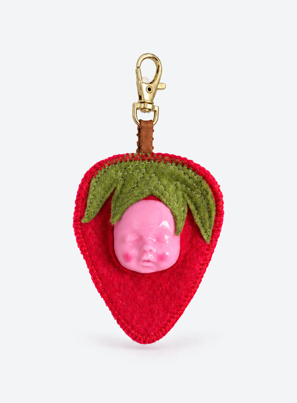 Handmade orange-shaped felt bag charm with a sculpted baby face, green leaves and a metal clasp