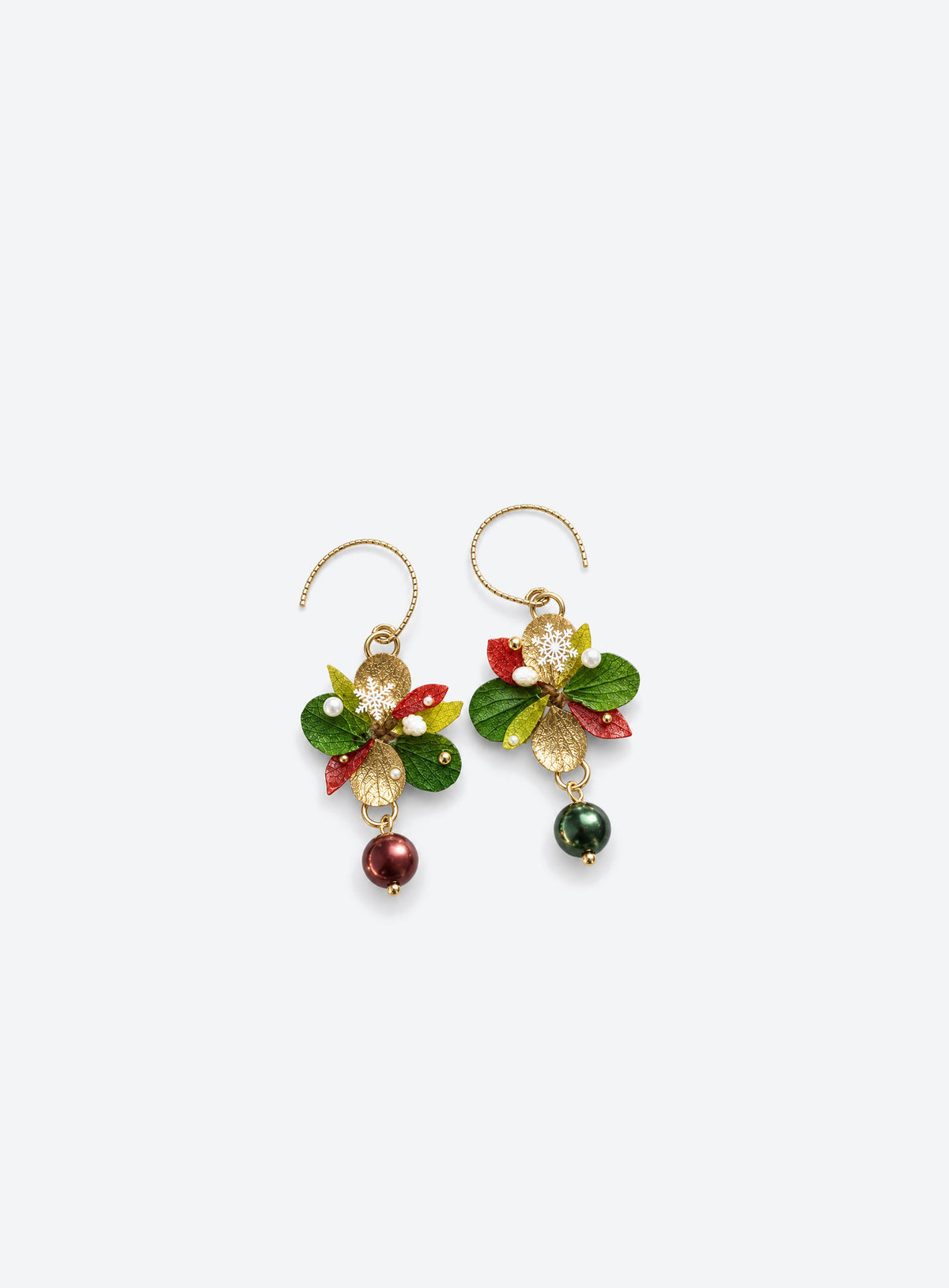 Layered red, green and gold-tone leaf earrings with curved hooks, snowflake details and red and green drops