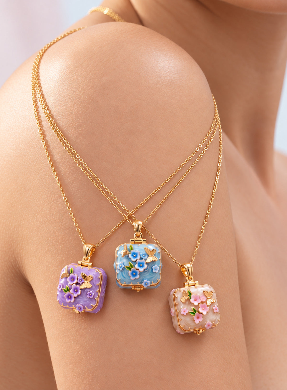 Square locket necklace with raised flowers, butterfly details, and gold-tone trim
