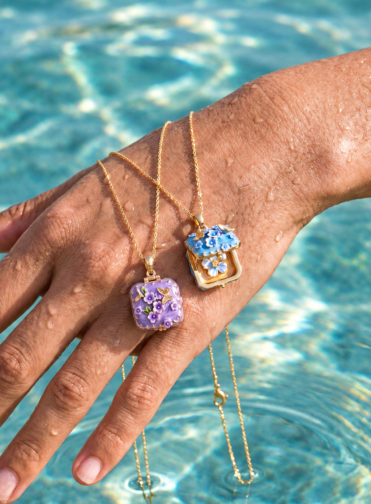 Square locket necklace with raised flowers, butterfly details, and gold-tone trim