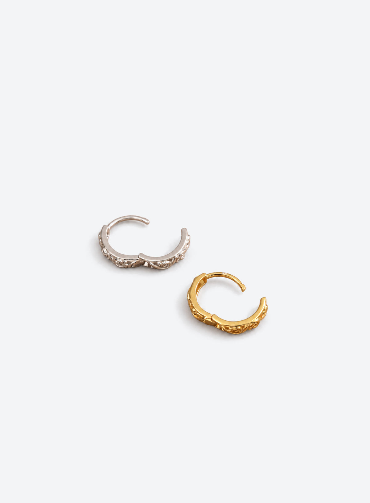 Floral openwork hoop earrings with a hinged clicker closure