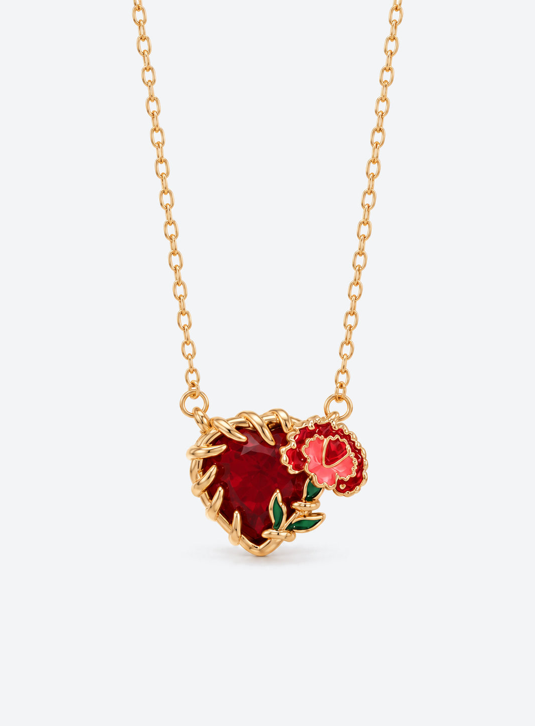 Heart-shaped crystal pendant necklace with enameled floral details and a gold-tone vine frame (January)