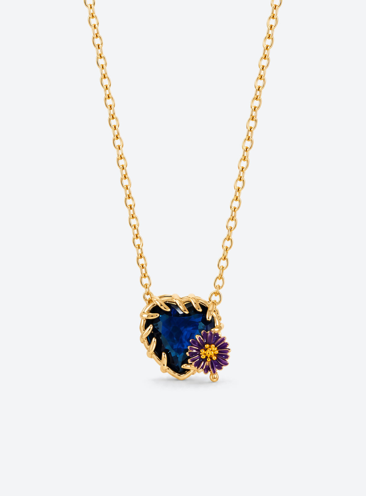 Heart-shaped crystal pendant necklace with enameled floral details and a gold-tone vine frame (September)