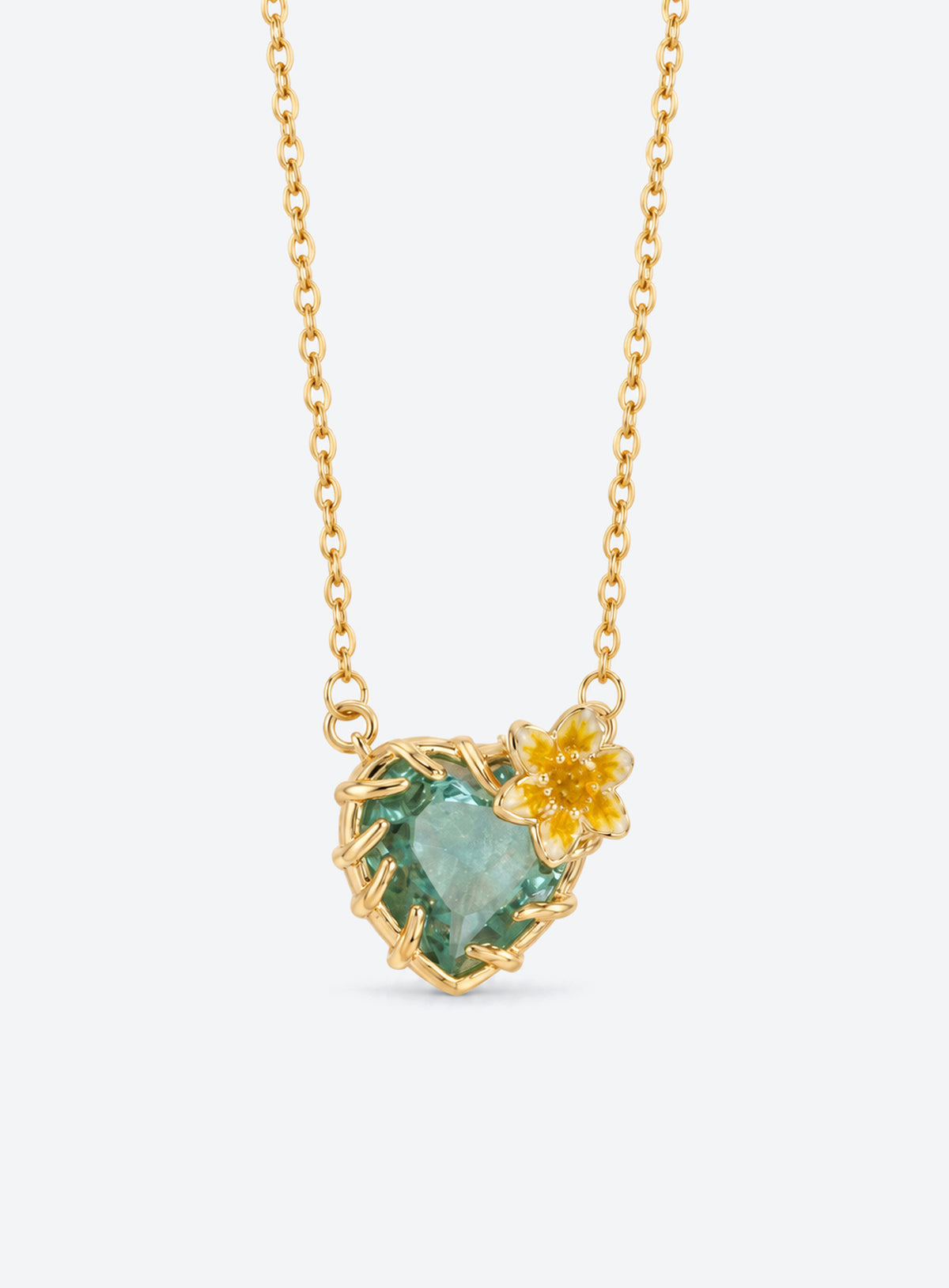 Heart-shaped crystal pendant necklace with enameled floral details and a gold-tone vine frame (March)