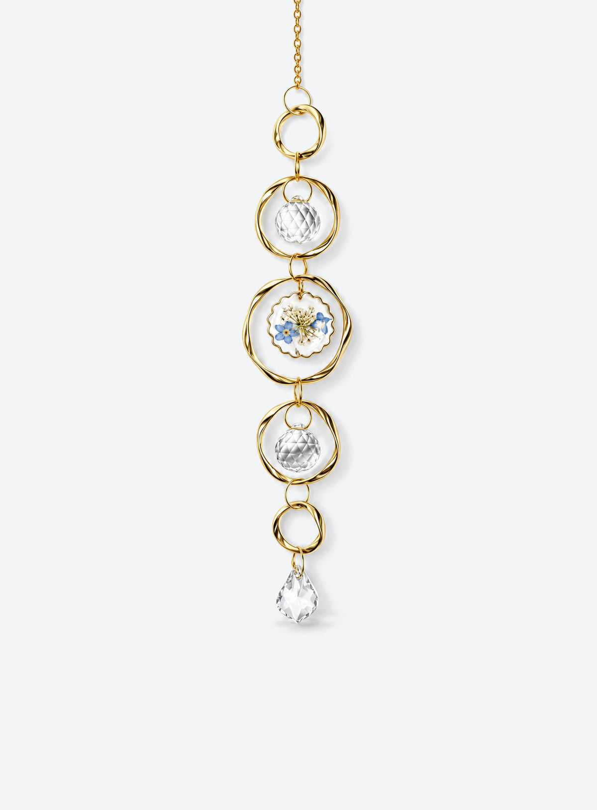Hanging suncatcher with gold-colored rings, clear faceted balls, a blue-and-white flower detail, and a teardrop pendant. (Clear)