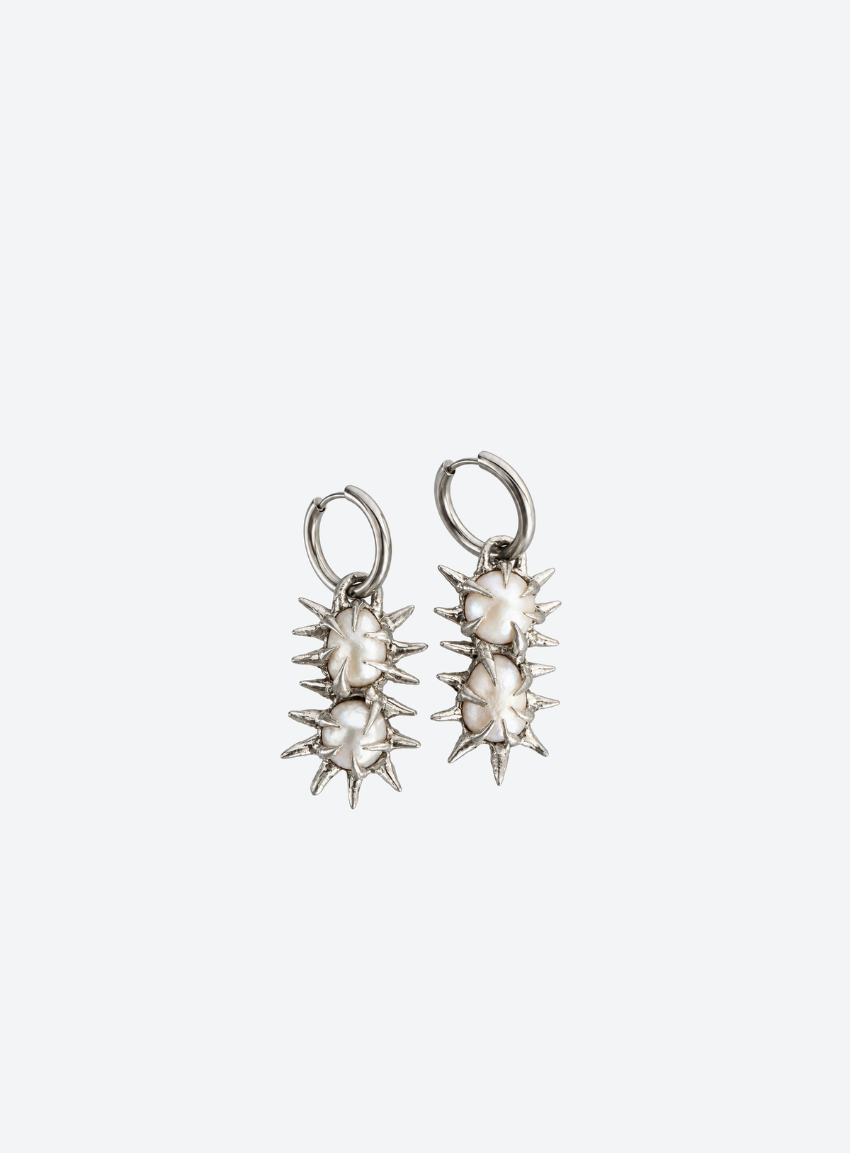 Silver-tone hoop earrings with freshwater pearls and pointed spikes