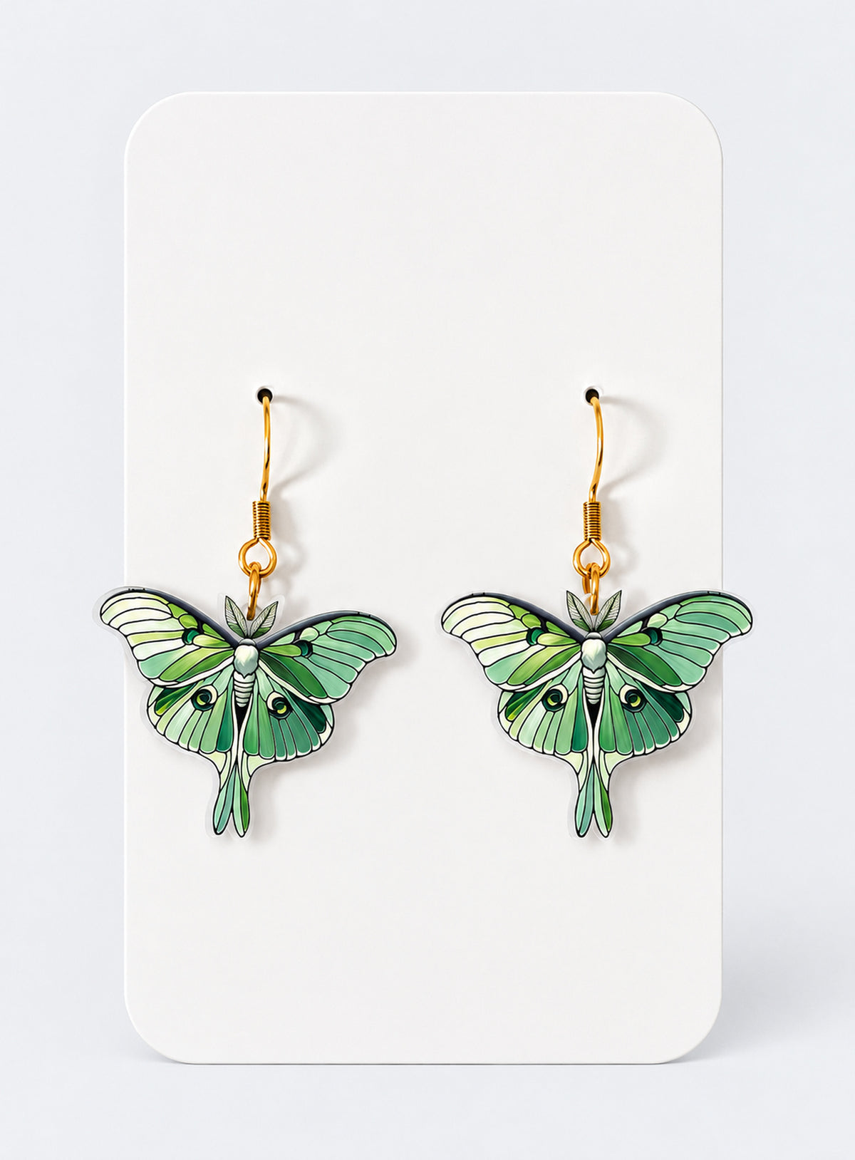 Pair of green luna moth dangle earrings with acrylic details and poplar wood bases
