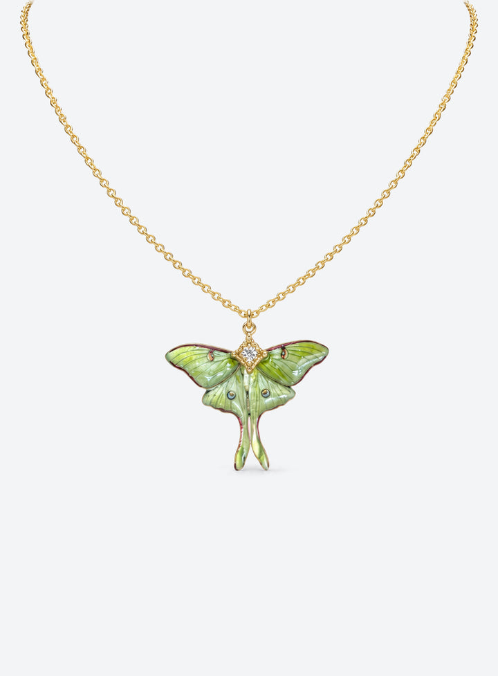 Pearlescent green luna moth pendant with painted wing details, two long tails, and clear body rhinestones