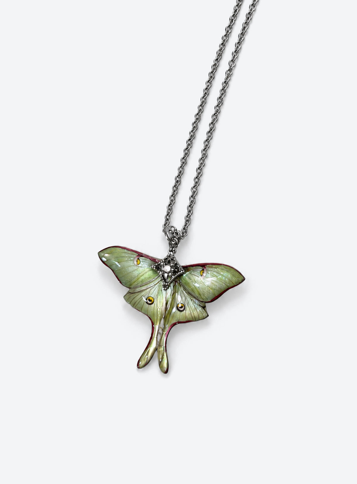 Pearlescent green luna moth pendant with painted wing details, two long tails, and clear body rhinestones
