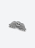 Small grey acetate hair claw with a winged skull design and dark outlines