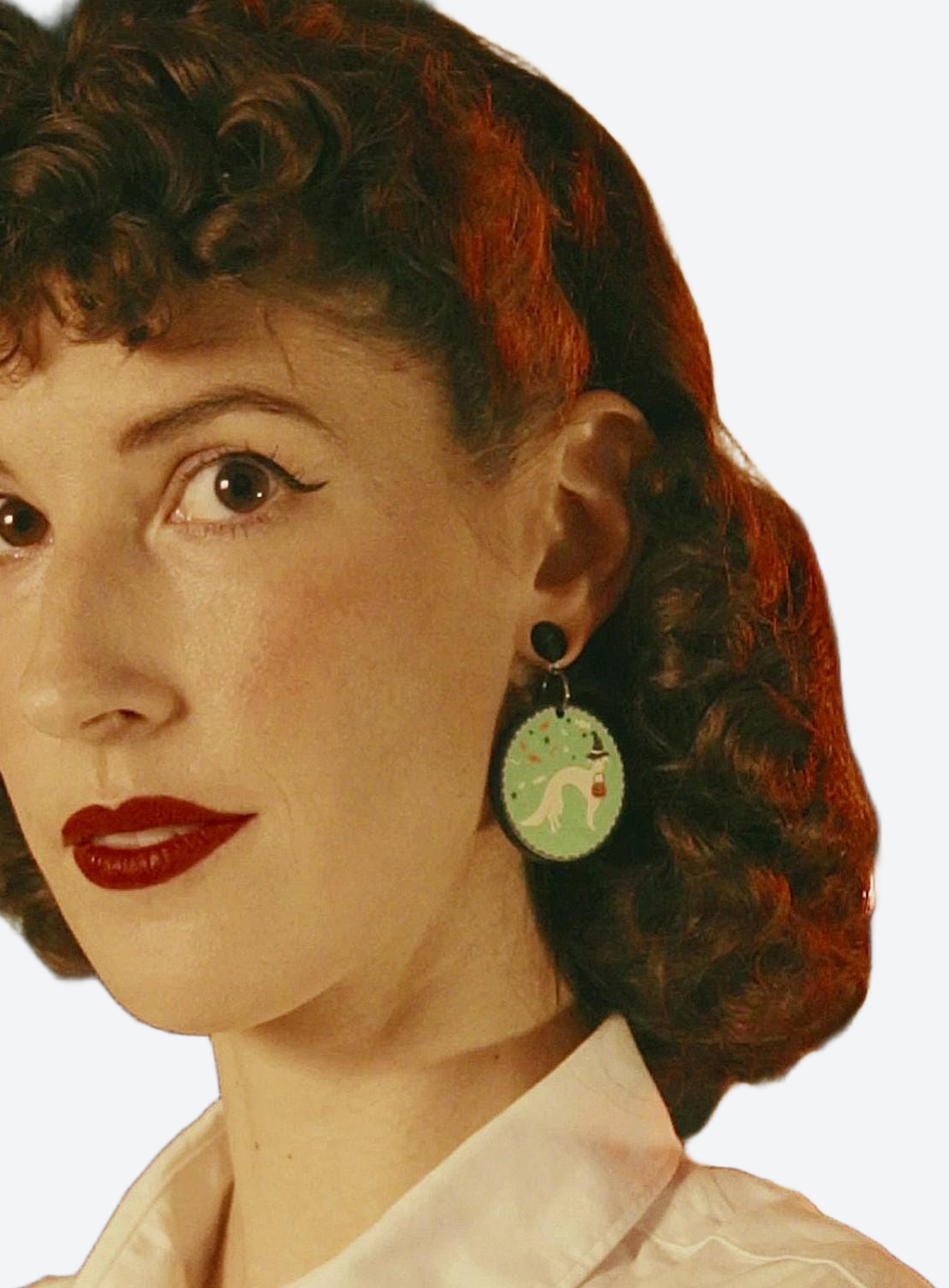 Acrylic Halloween dog charm earrings shown in a studio product photo