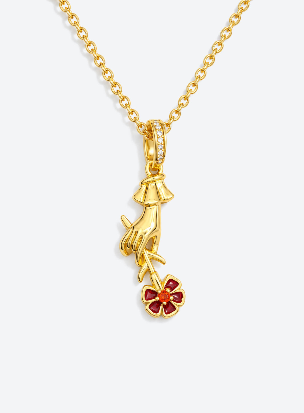 Necklace with a sculpted hand pendant holding a floral bouquet with crystal accents (January)
