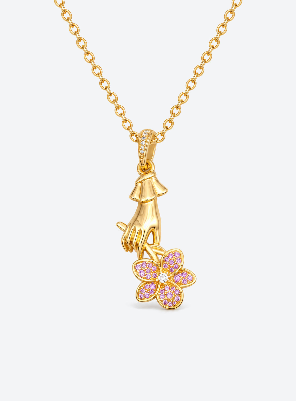 Necklace with a sculpted hand pendant holding a floral bouquet with crystal accents (February)