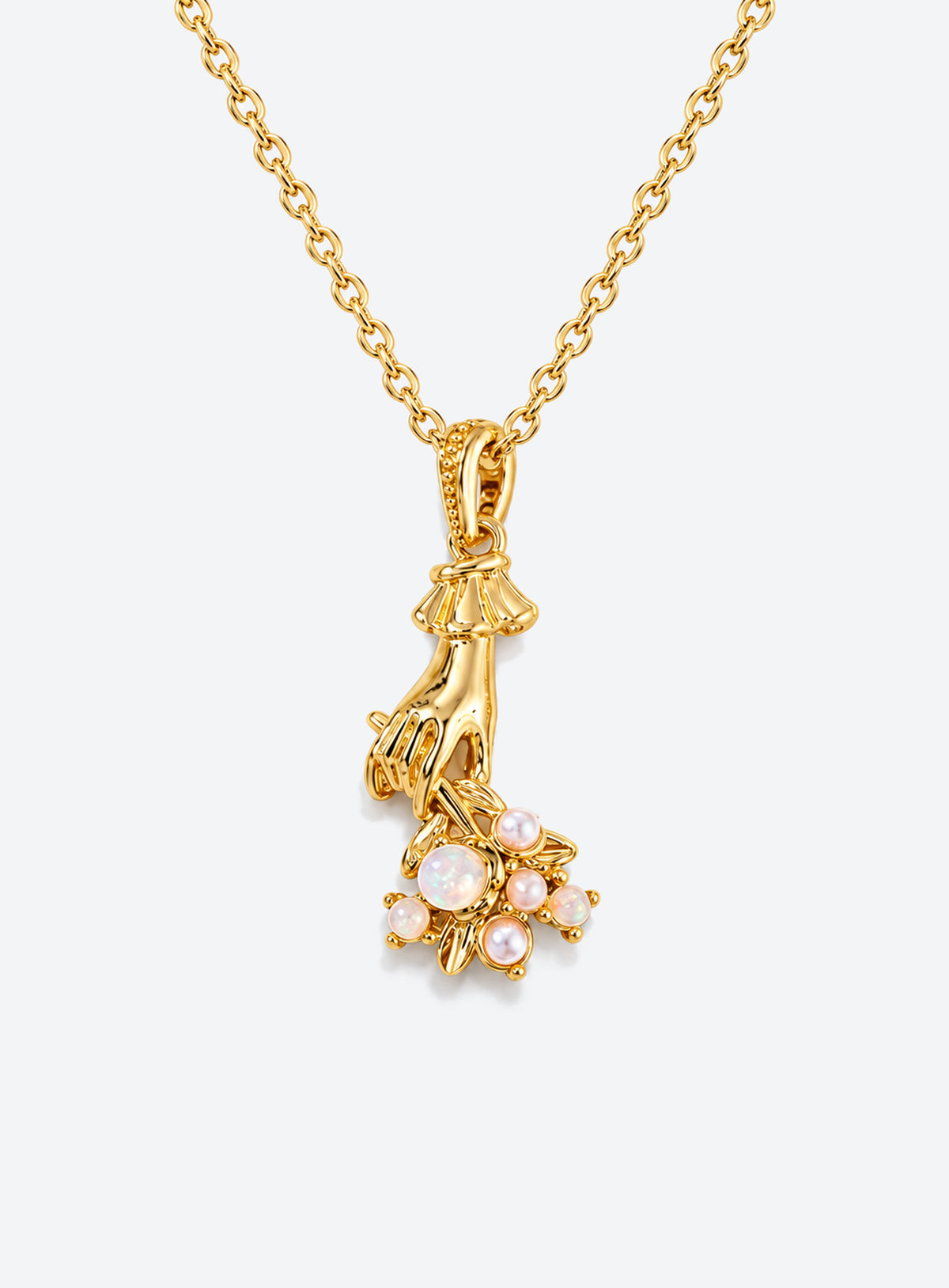 Necklace with a sculpted hand pendant holding a floral bouquet with crystal accents (June)