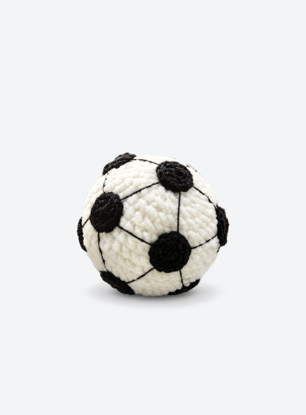 Cotton crochet footbag with visible yarn stitches and a textured, rounded shape