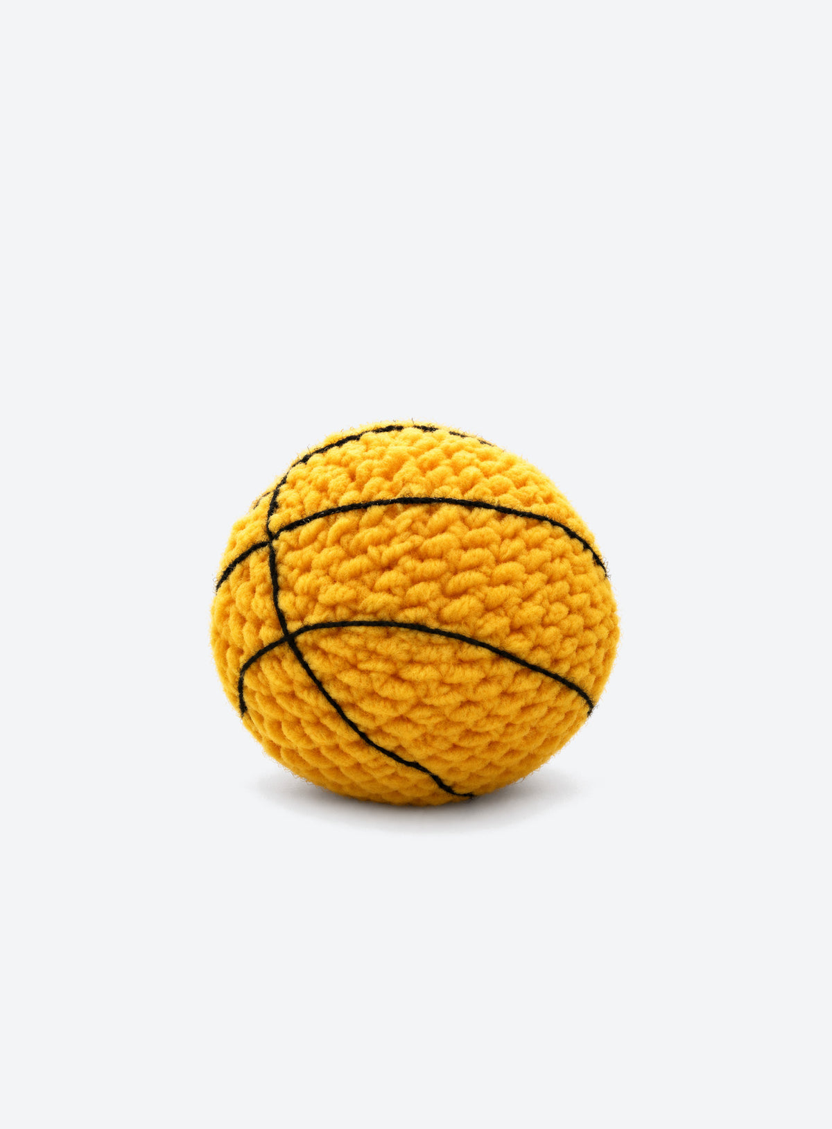 Cotton crochet footbag with visible yarn stitches and a textured, rounded shape