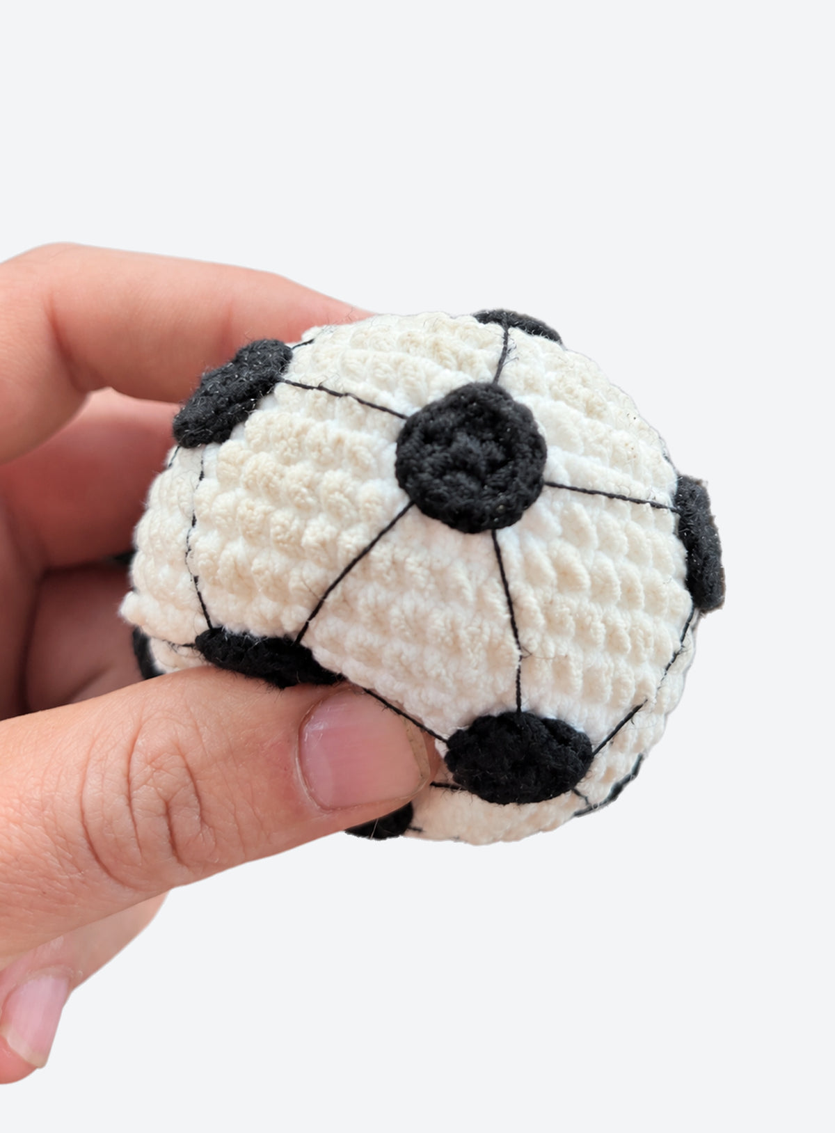 Cotton crochet footbag with visible yarn stitches and a textured, rounded shape