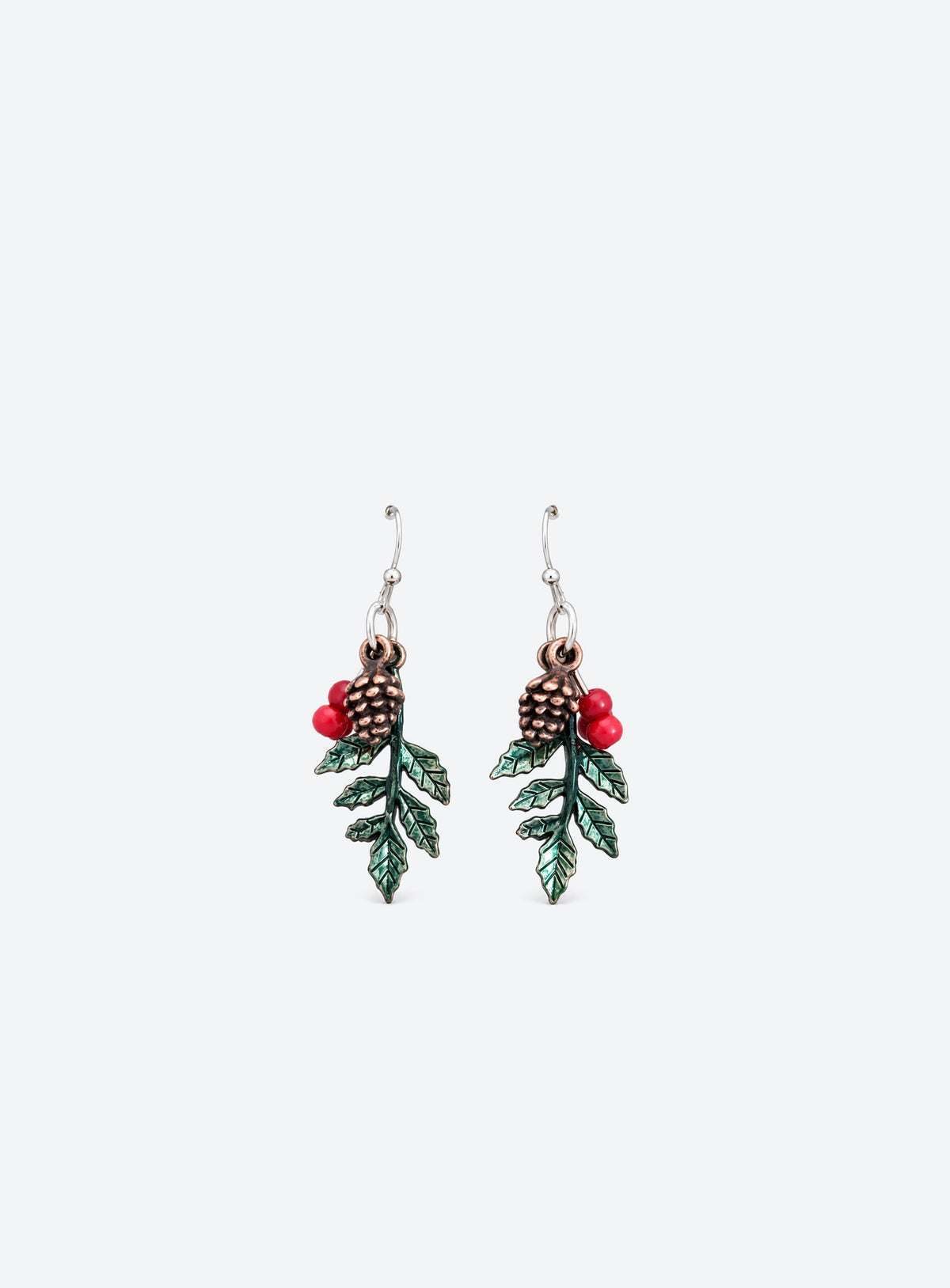 Drop earrings with green holly leaves, red berry beads, bronze-tone pinecones and silver-tone ball-hook ear wires.