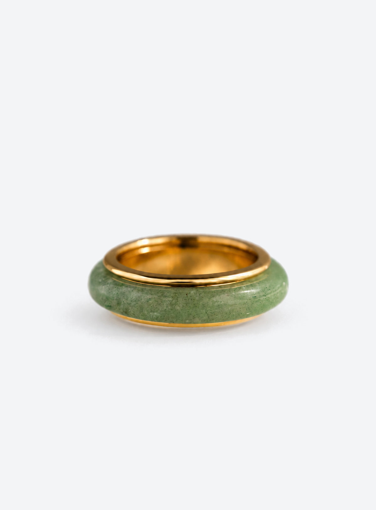 Green jade spinner ring with a gold-tone band