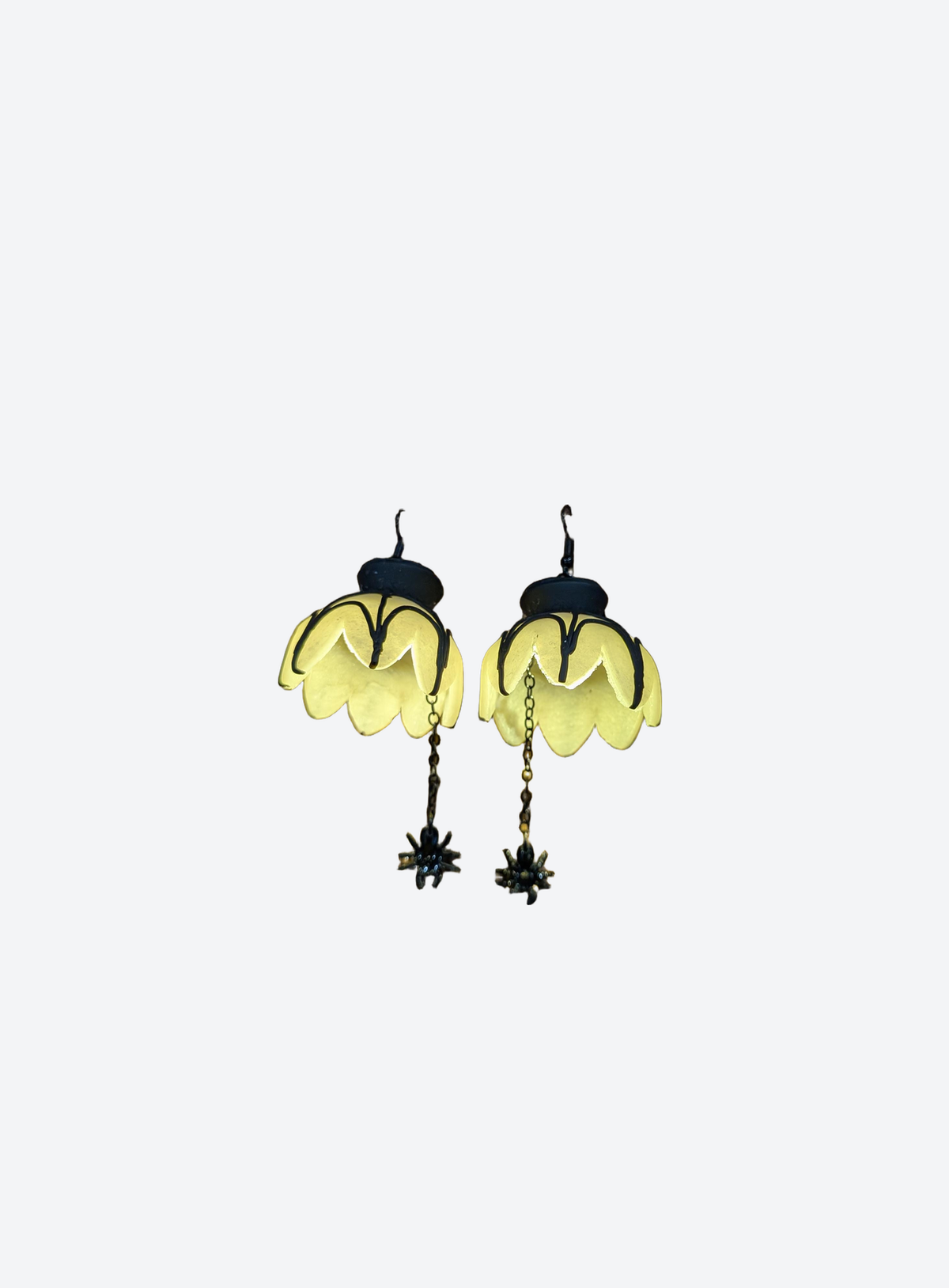Light-up polymer clay spider web chandelier earrings in a studio photo