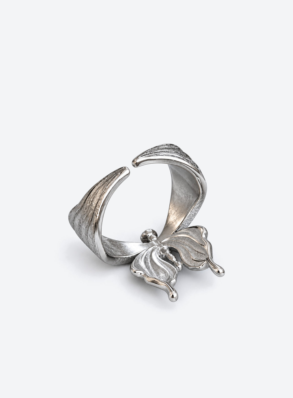 A silver-tone luna moth ring with brushed wings, polished tail details and an open wraparound band