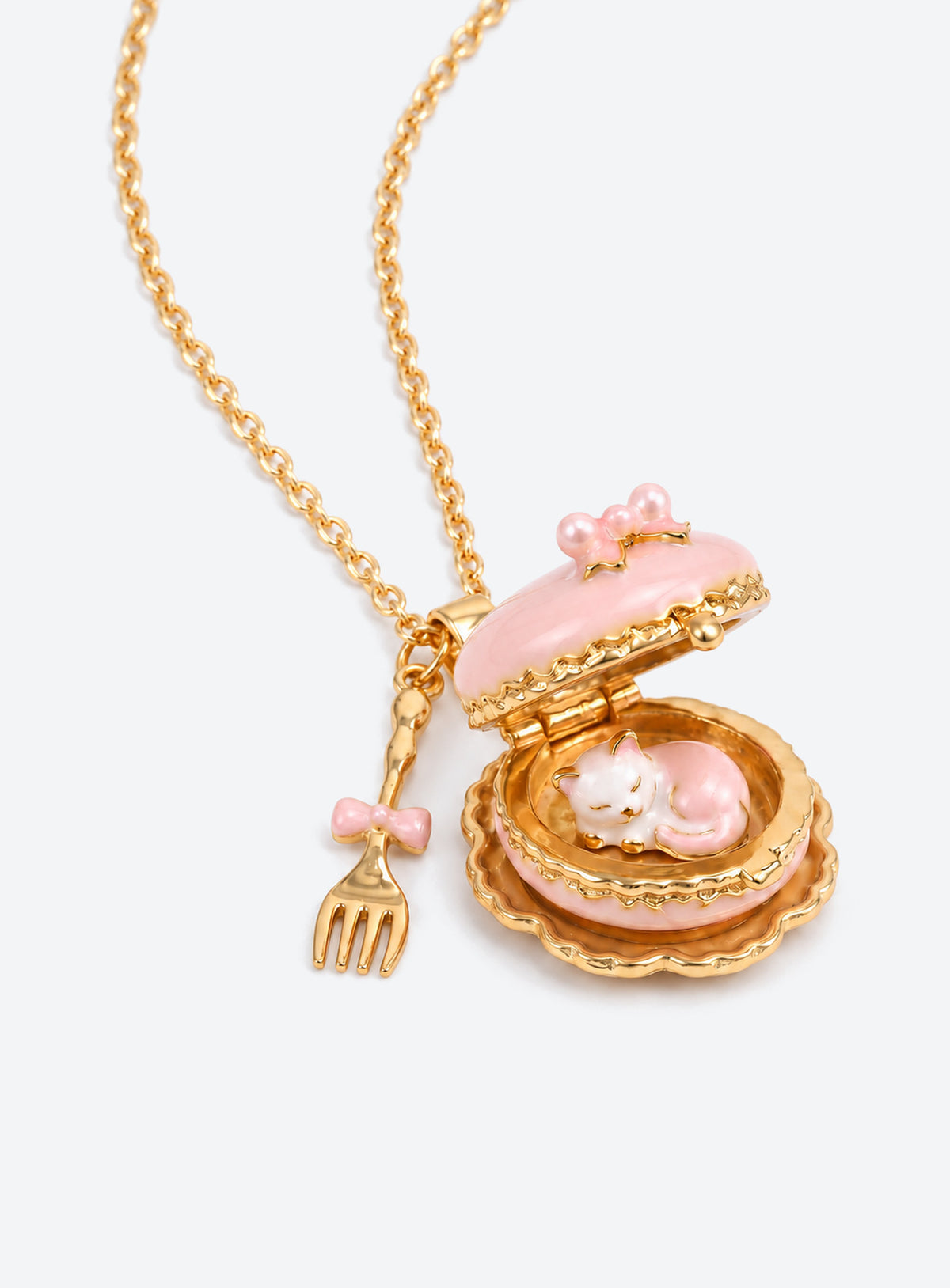 Cake-shaped enamel locket necklace with gold-tone trim and chain, plus a miniature cutlery charm (Pink)