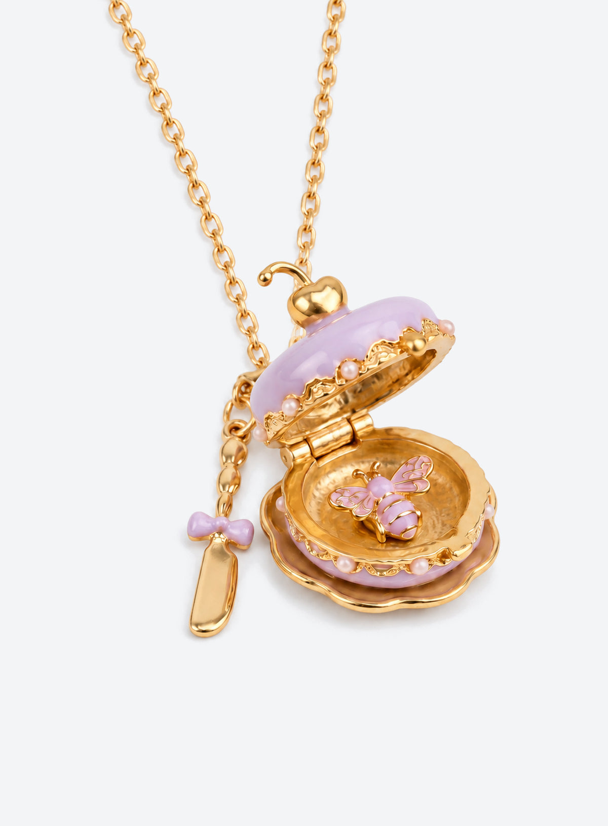 Cake-shaped enamel locket necklace with gold-tone trim and chain, plus a miniature cutlery charm (Purple)