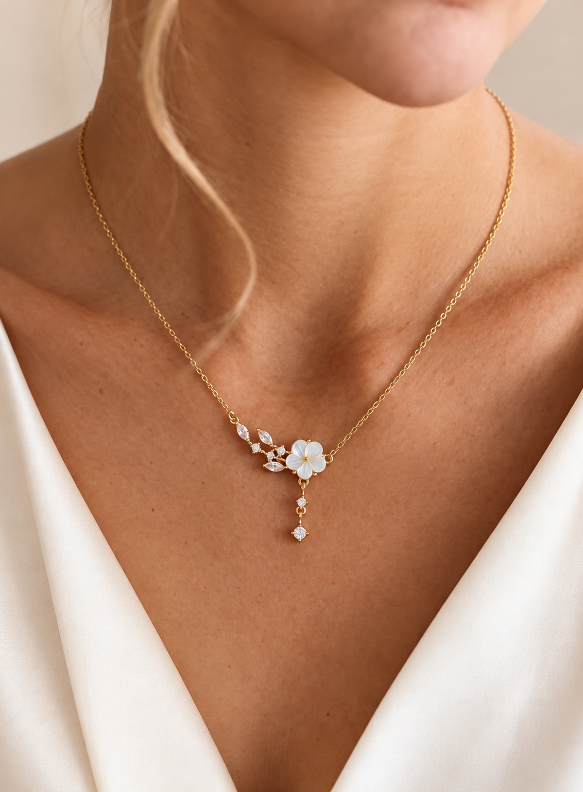 Mother of pearl flower necklace with marquise CZ leaf accents and a crystal drop