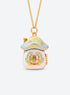 Gold-tone necklace with an enamel mushroom house locket and a hinged door