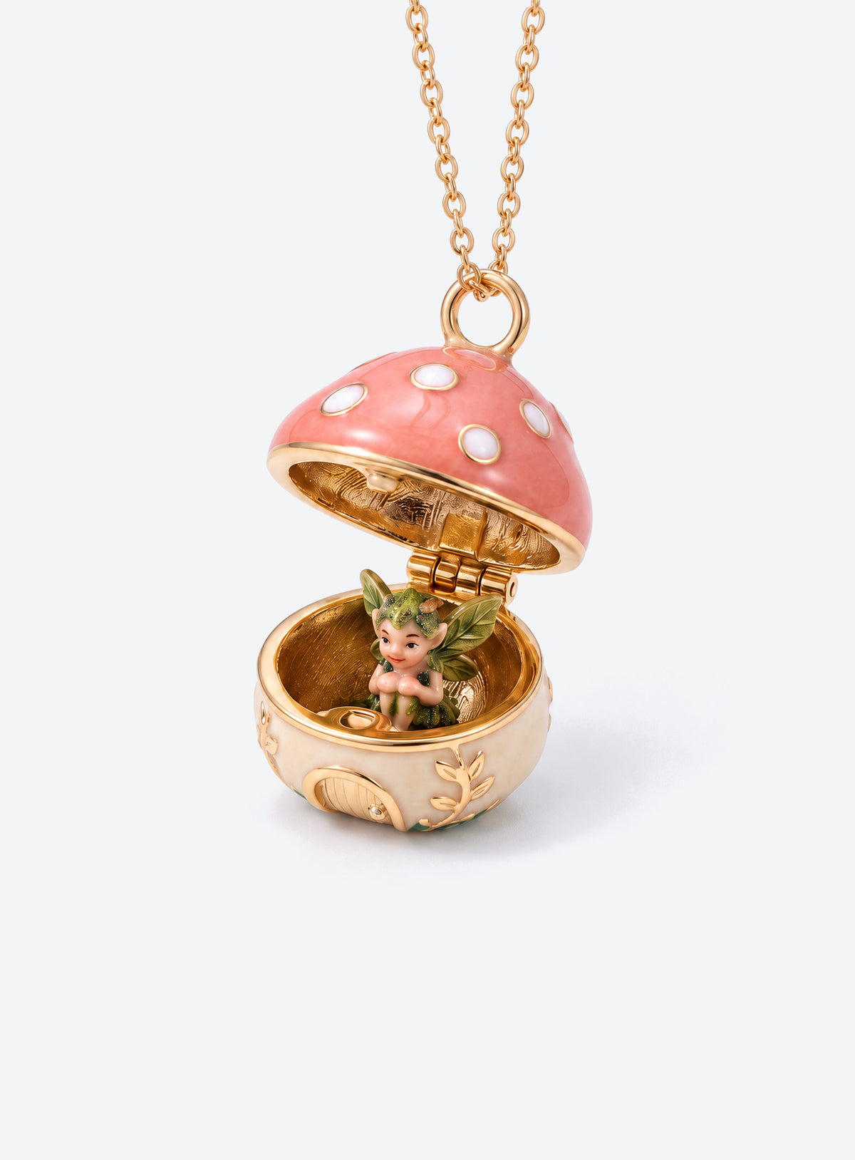 An open mushroom house pendant necklace with a miniature figure beneath its spotted enamel cap
