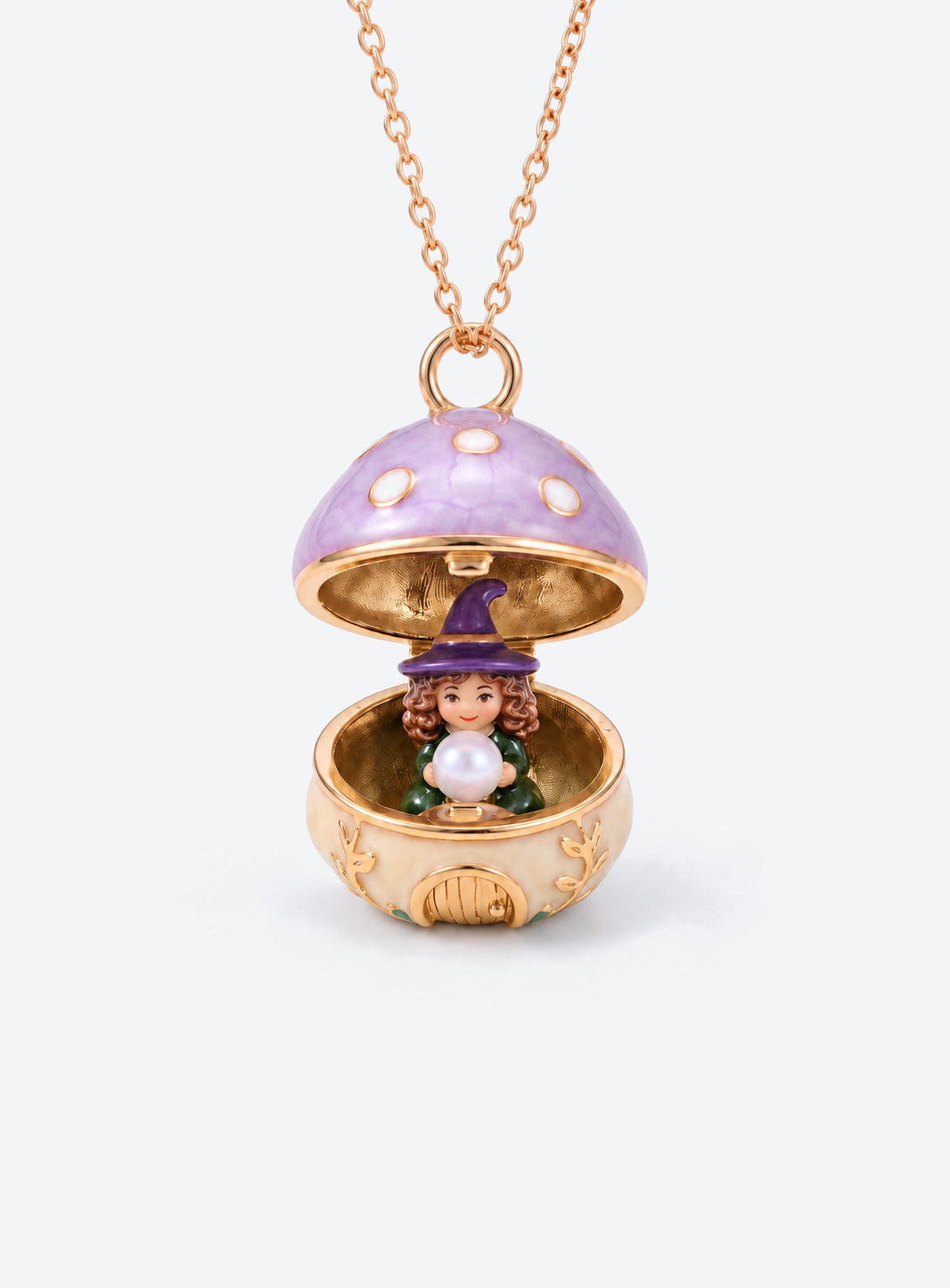 An open mushroom house pendant necklace with a miniature figure beneath its spotted enamel cap