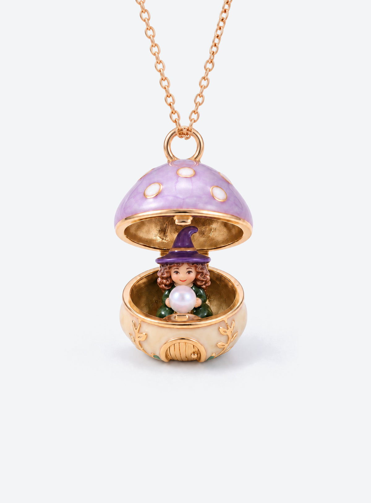An open mushroom house pendant necklace with a miniature figure beneath its spotted enamel cap