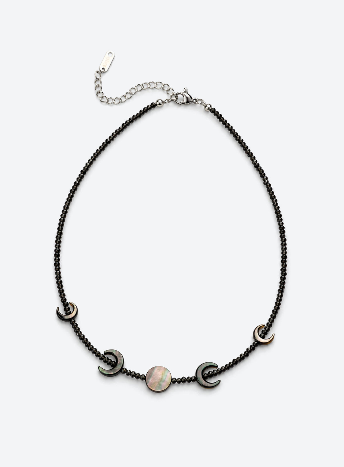 Black beaded necklace with four outward-facing shell crescents around a round center disc and a silver-finish clasp. (Silver)