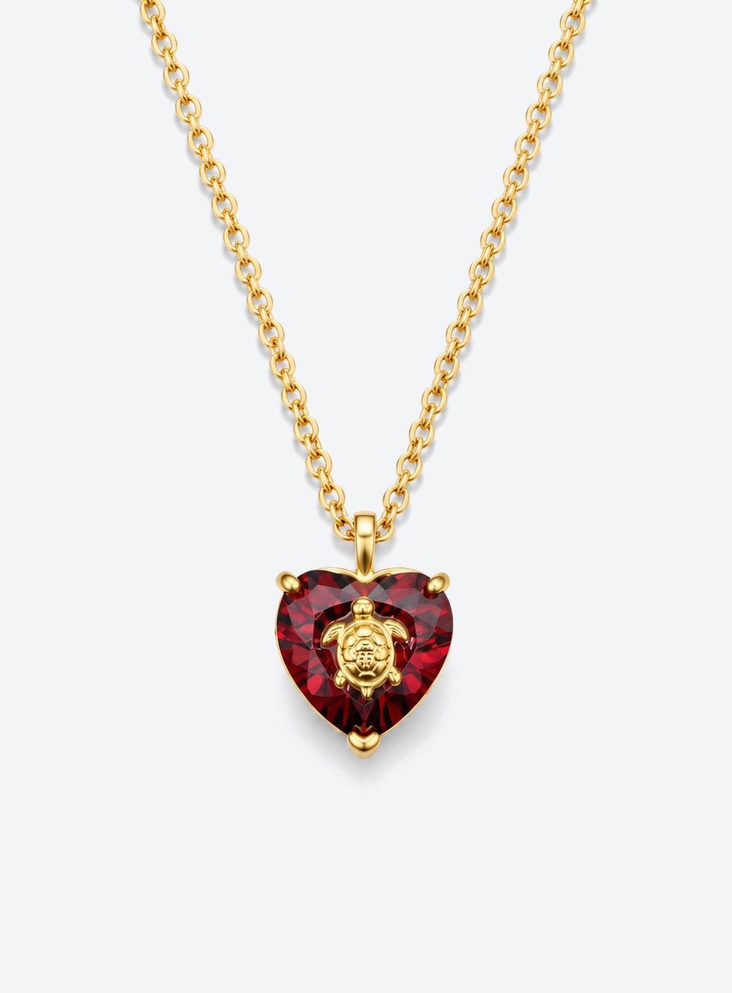 Heart-shaped crystal pendant necklace with a small gold-tone sea motif (January)