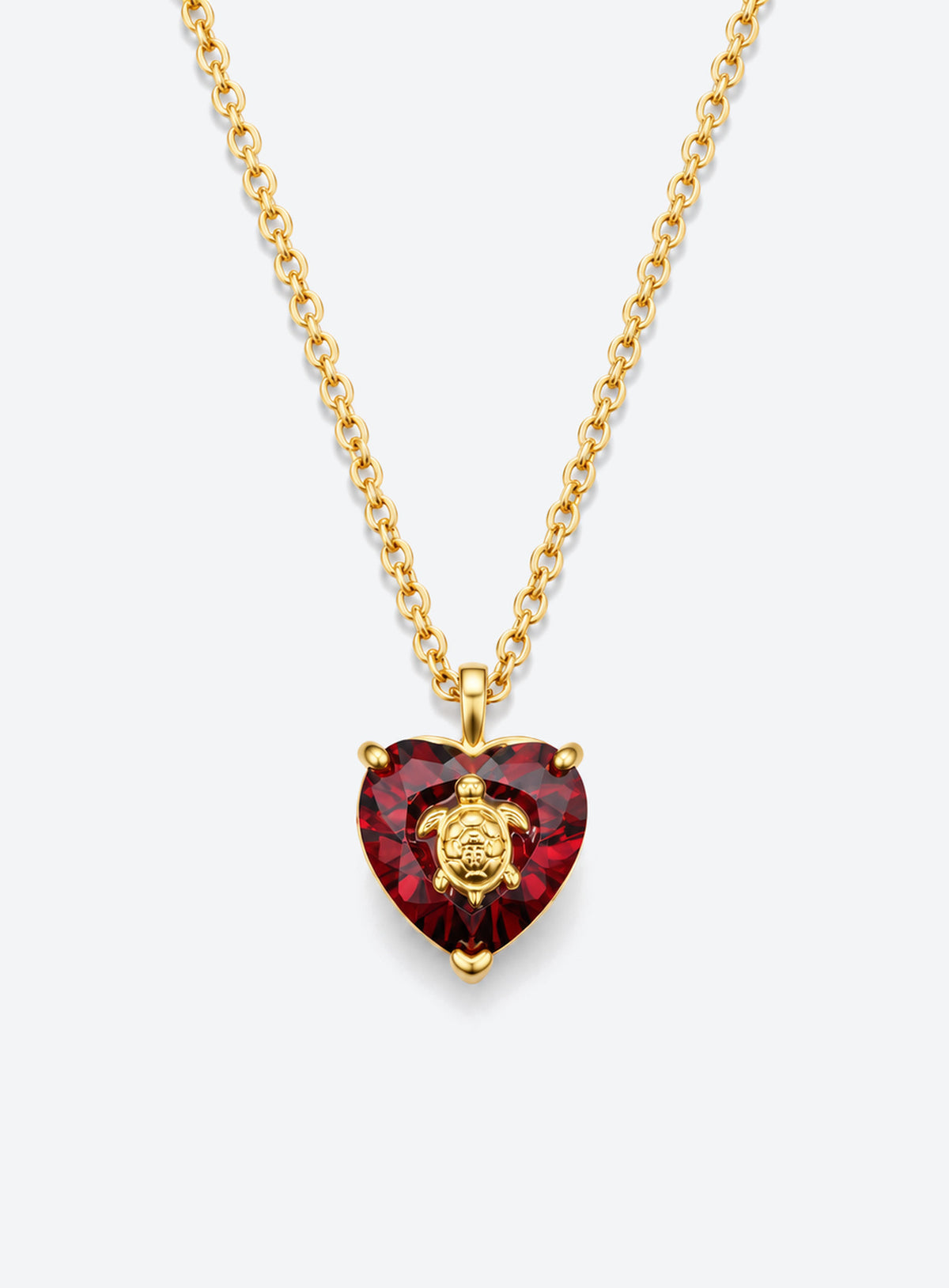 Heart-shaped crystal pendant necklace with a small gold-tone sea motif (January)