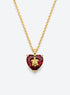 Heart-shaped crystal pendant necklace with a small gold-tone sea motif (January)