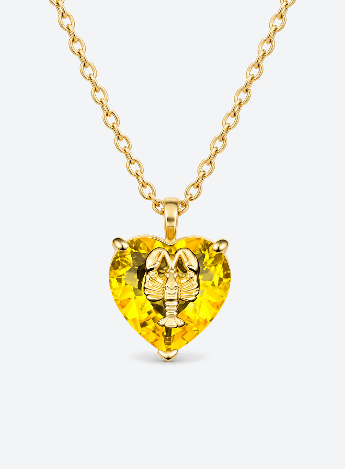 Heart-shaped crystal pendant necklace with a small gold-tone sea motif (November)