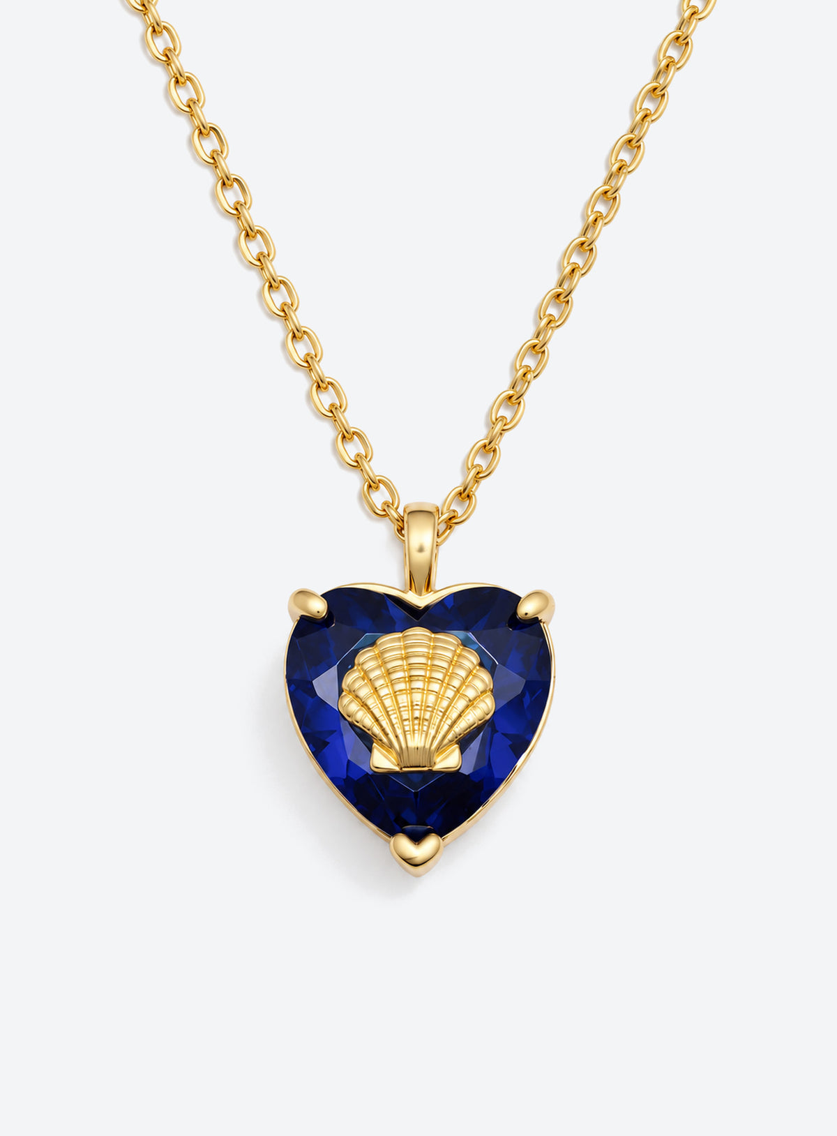 Heart-shaped crystal pendant necklace with a small gold-tone sea motif (February)