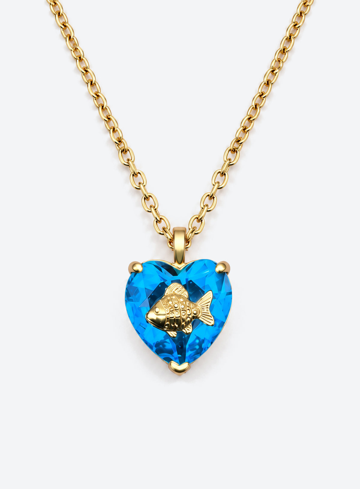 Heart-shaped crystal pendant necklace with a small gold-tone sea motif (March)