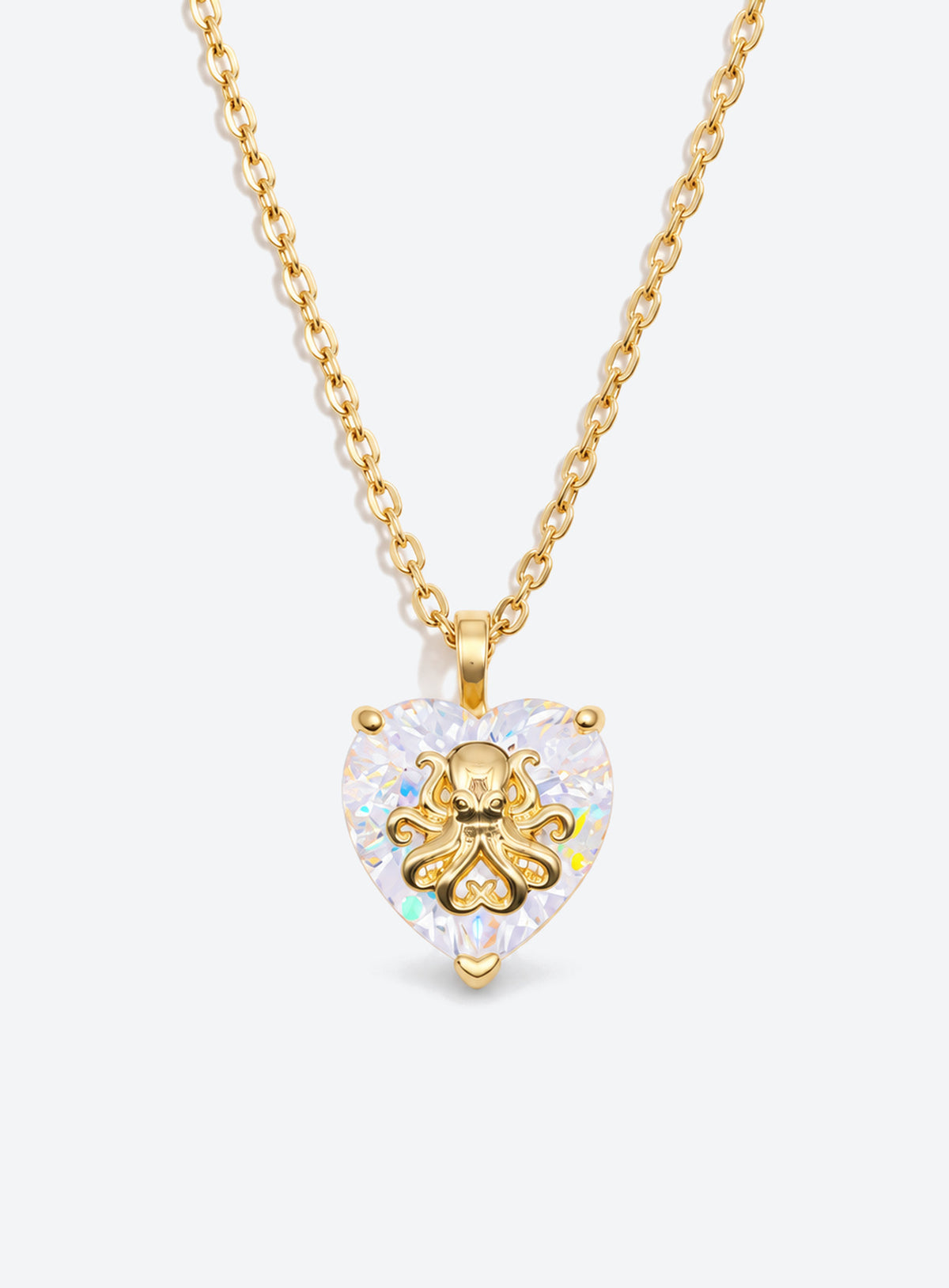 Heart-shaped crystal pendant necklace with a small gold-tone sea motif (April)