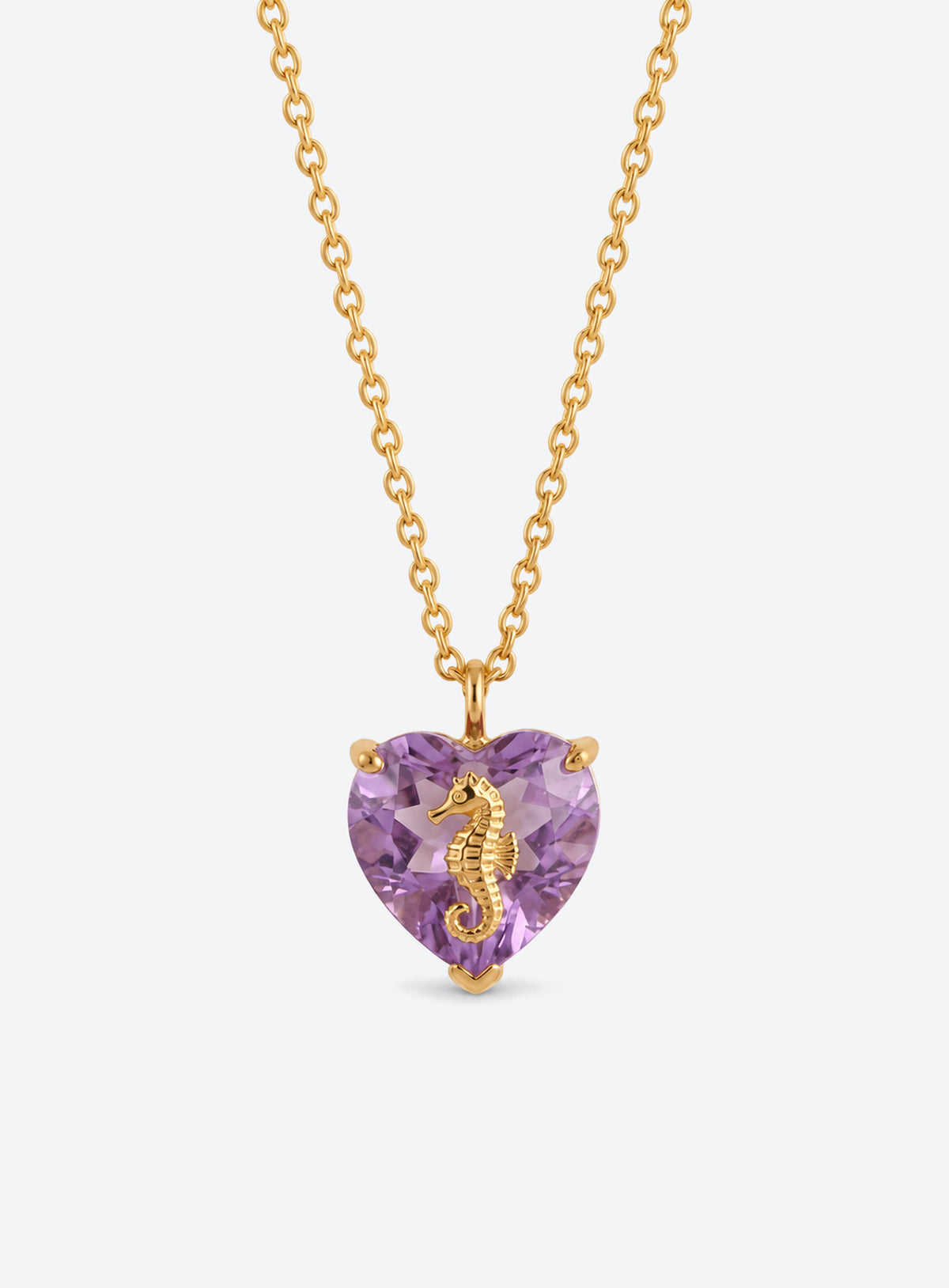 Heart-shaped crystal pendant necklace with a small gold-tone sea motif (June)