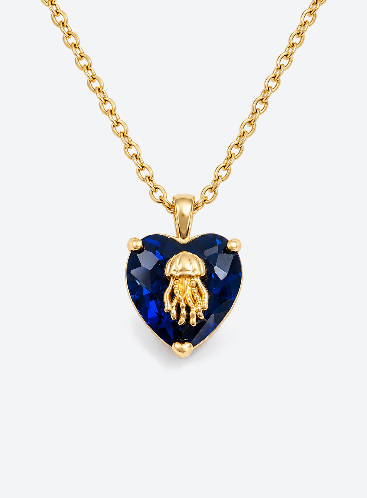 Heart-shaped crystal pendant necklace with a small gold-tone sea motif (September)