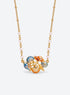 Ocean-themed necklace with a pearl station chain and a cluster of shells, sea creatures, or colorful fish (Conch Shell)