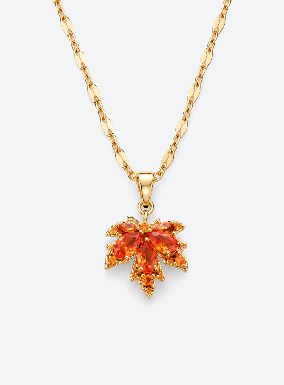 Orange crystal maple leaf pendant on a gold-tone leaf-link chain