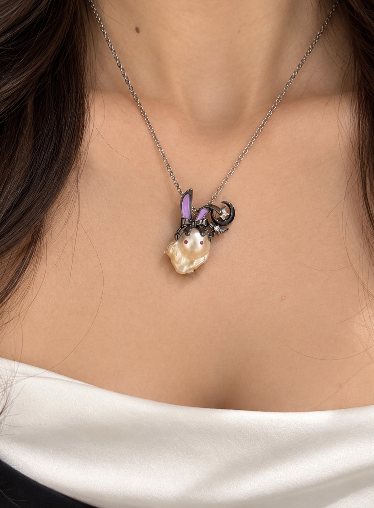 Irregular baroque pearl ghost charm with decorative character accents