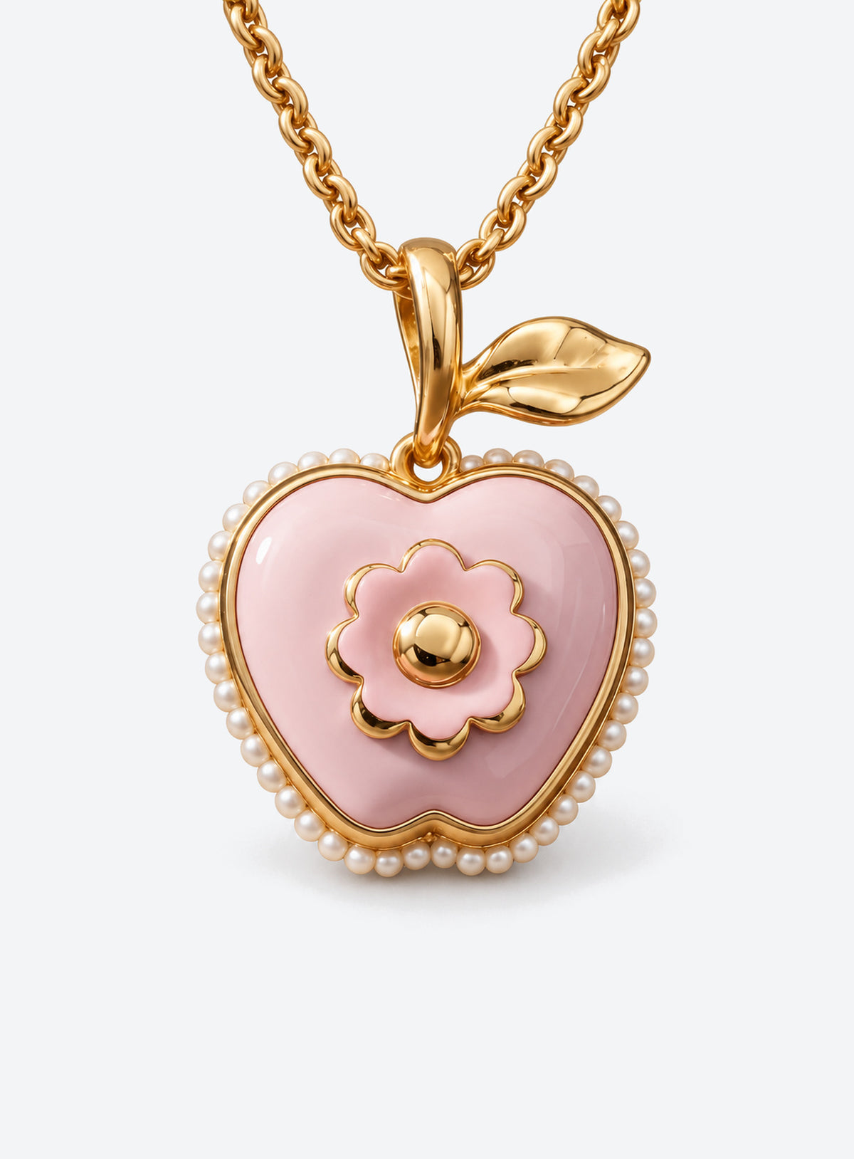 Pink apple-shaped locket necklace with a leaf, flower detail and small white pearl-like trim