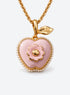 Pink apple-shaped locket necklace with a leaf, flower detail and small white pearl-like trim